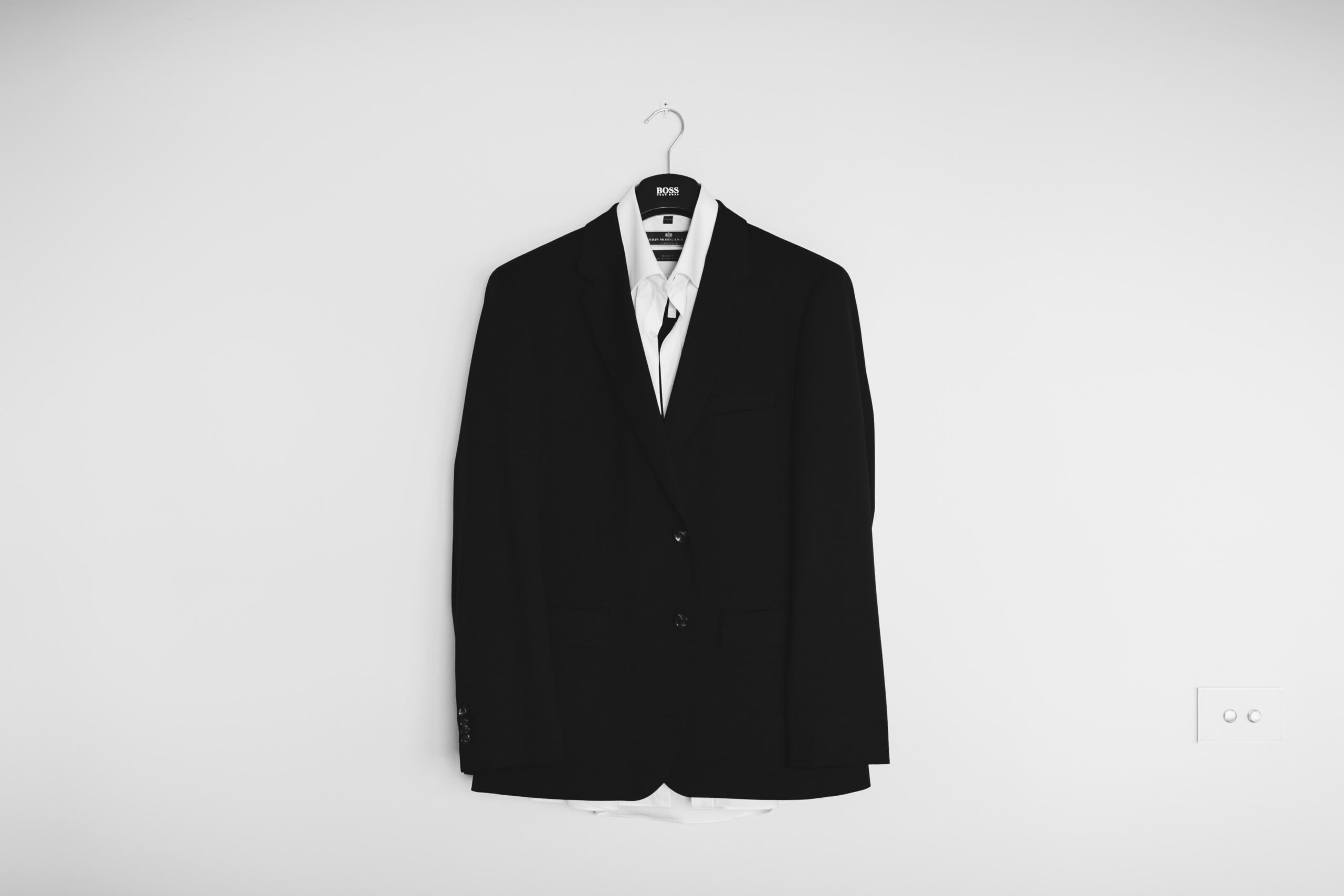 Black Suit Hanging On Wall